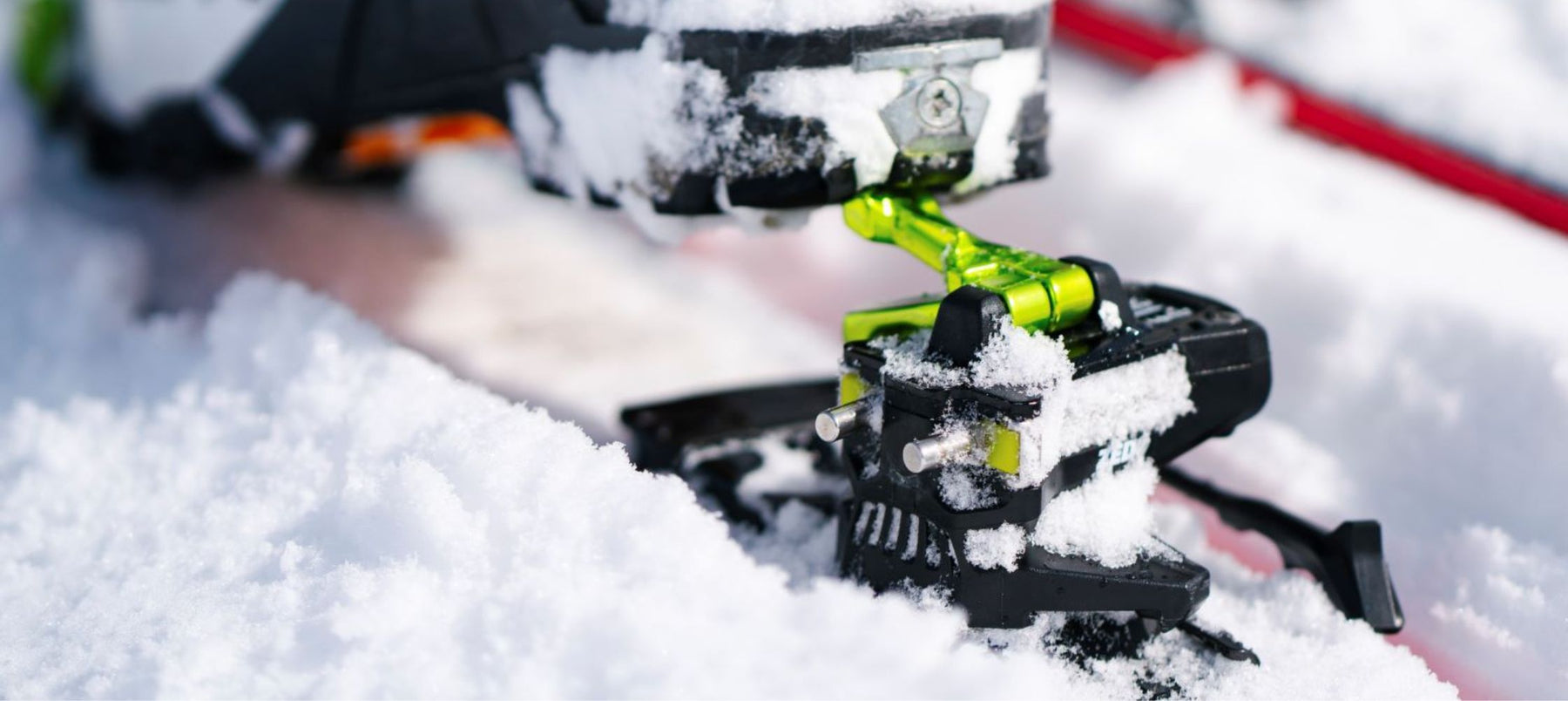 close up of boots stepping on tech bindings