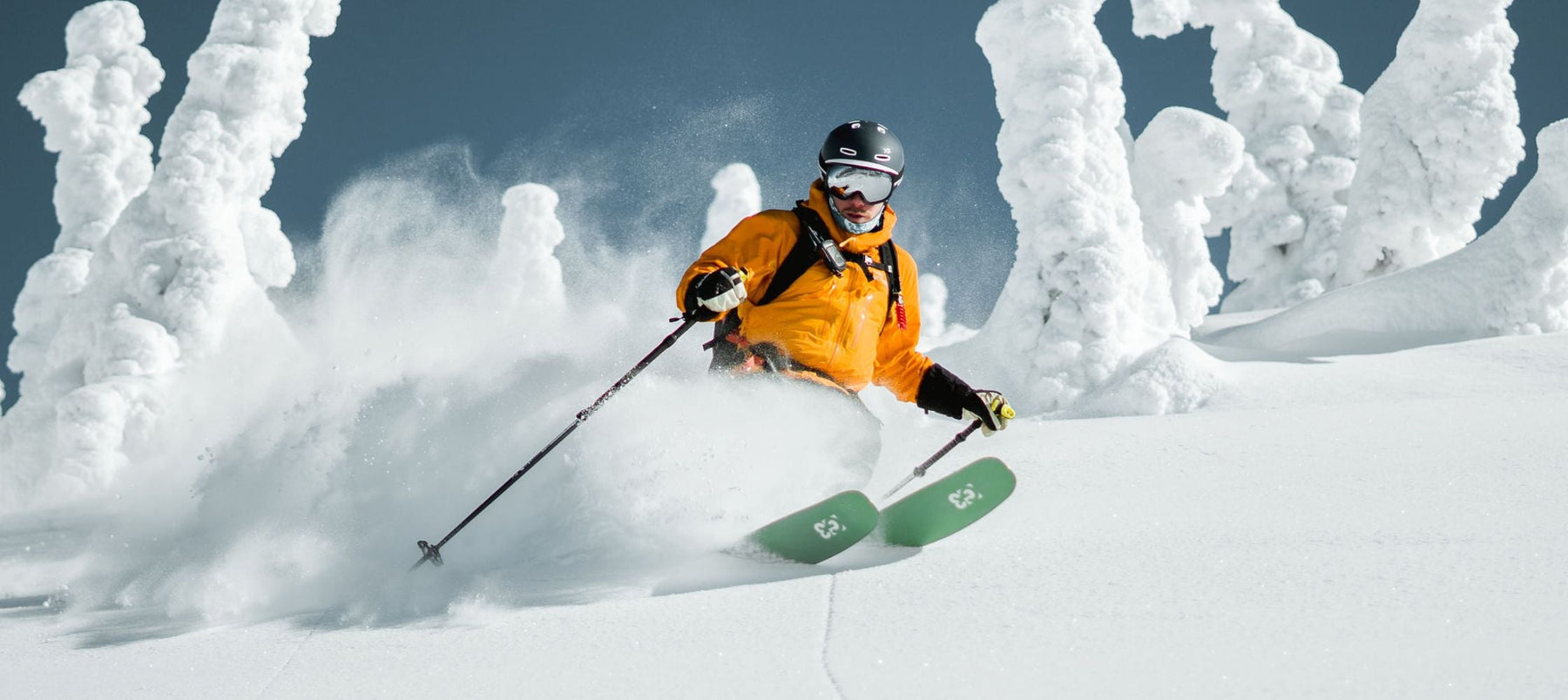 two people ski touring and holding poles